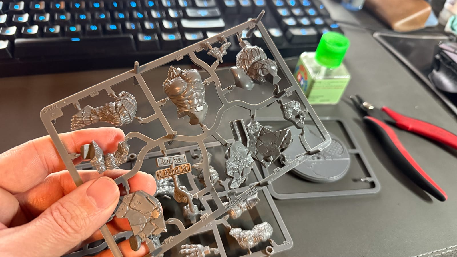 A photo of sprues from Marvel Crisis Protocol