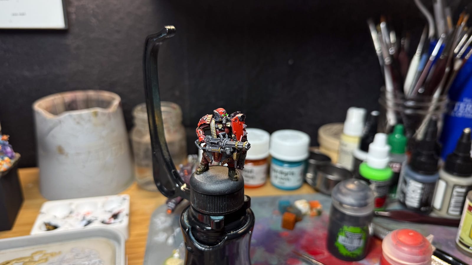 A photo of a Warmachine model on a holder