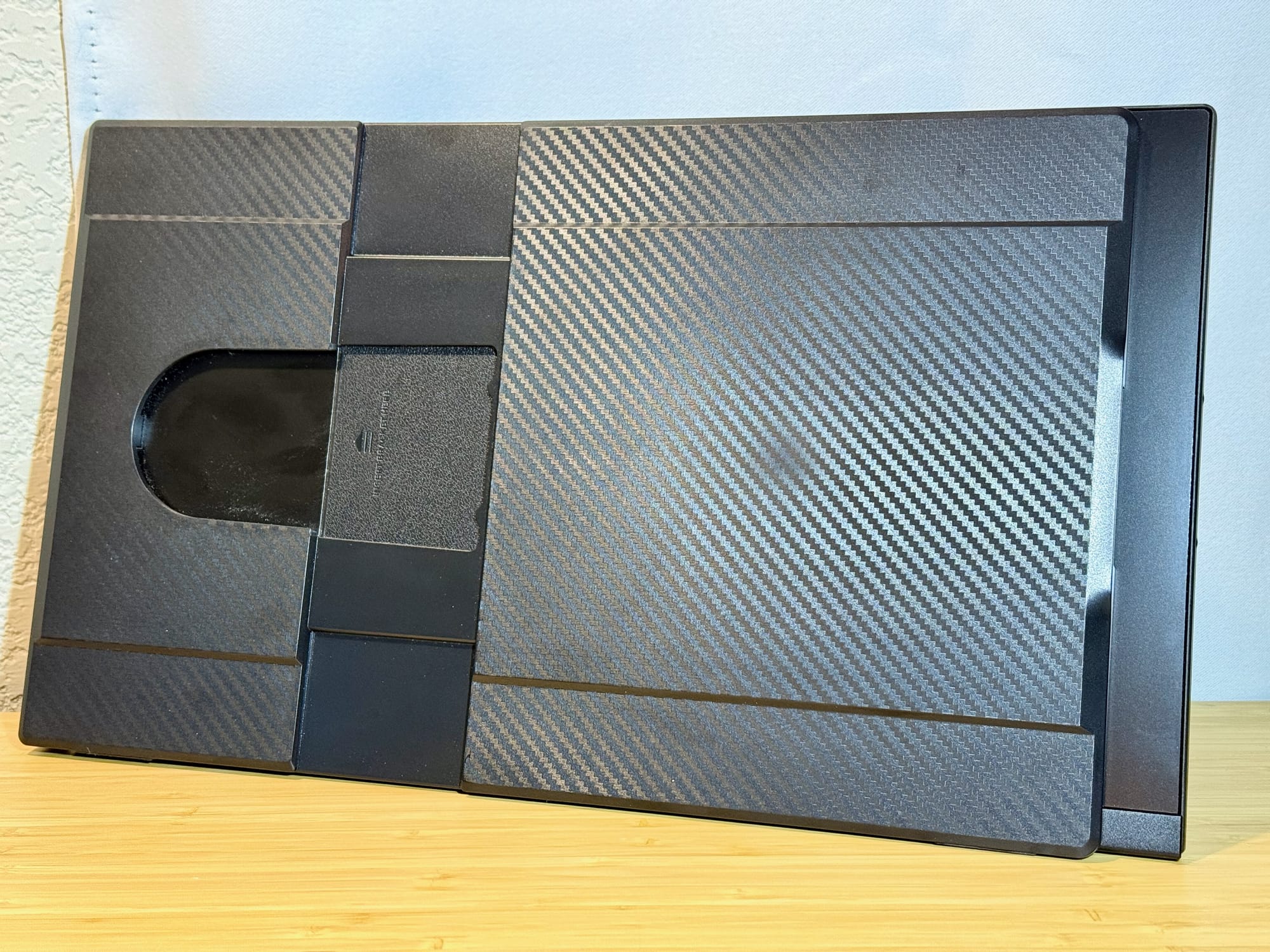 Case with the Kevlar-esque texture showing the screen without full coverage.