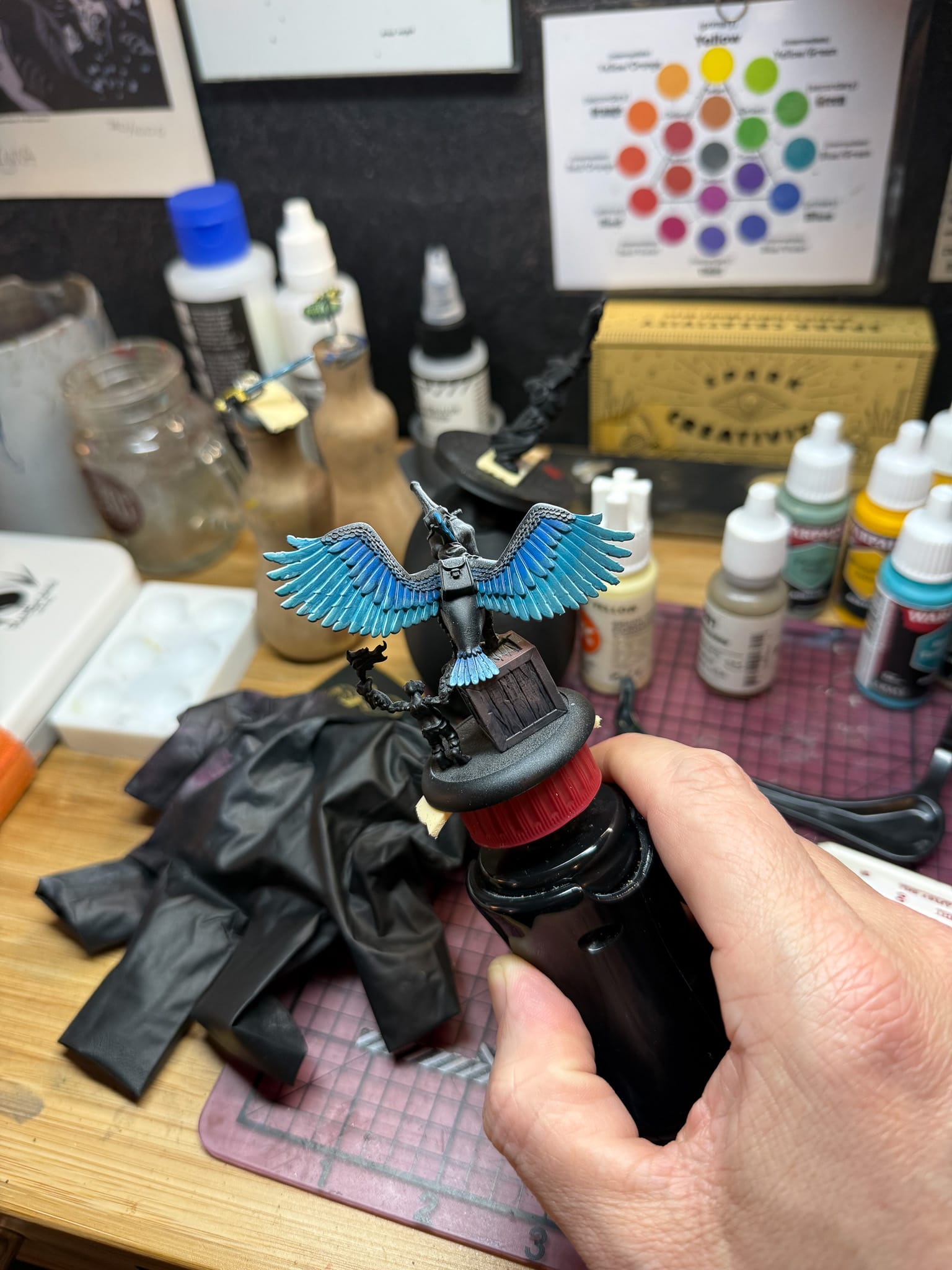 A photo of a model with Army Painter John Blanche Vol 3 paints