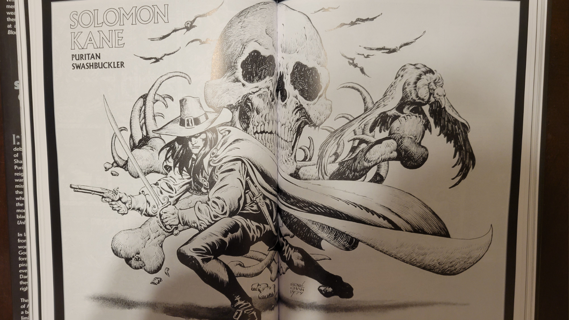 Solomon Kane stands with sword and pistol at the ready across this double page spread.