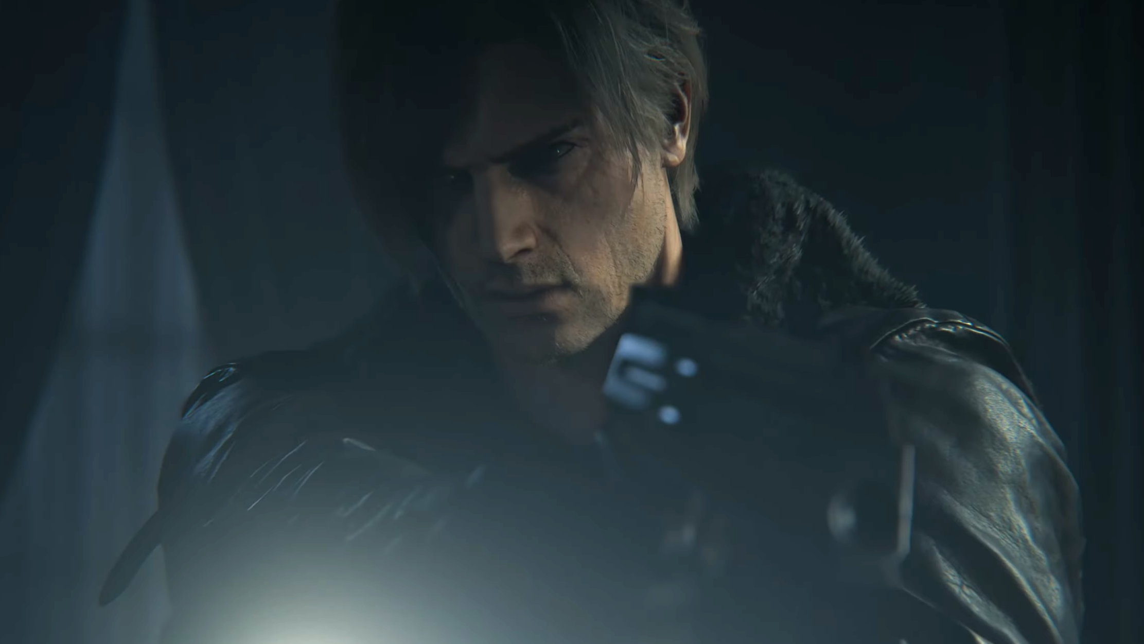 Leon looking at something with his gun up. He is wearing a leather jacket and has some stubble now.