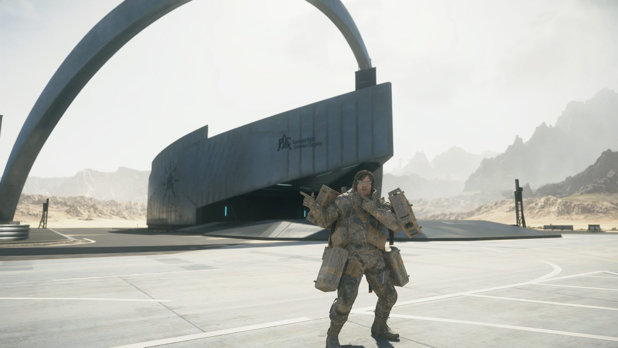 Sam posing in front of an APAC facility.