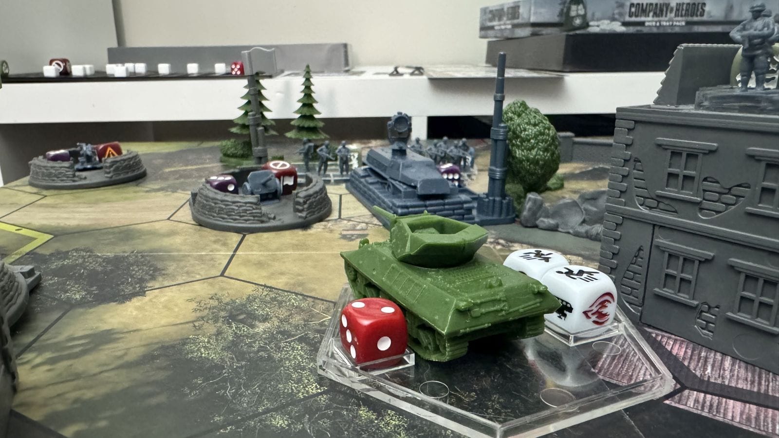 A tank is positioned to attack an enemy emplacement.