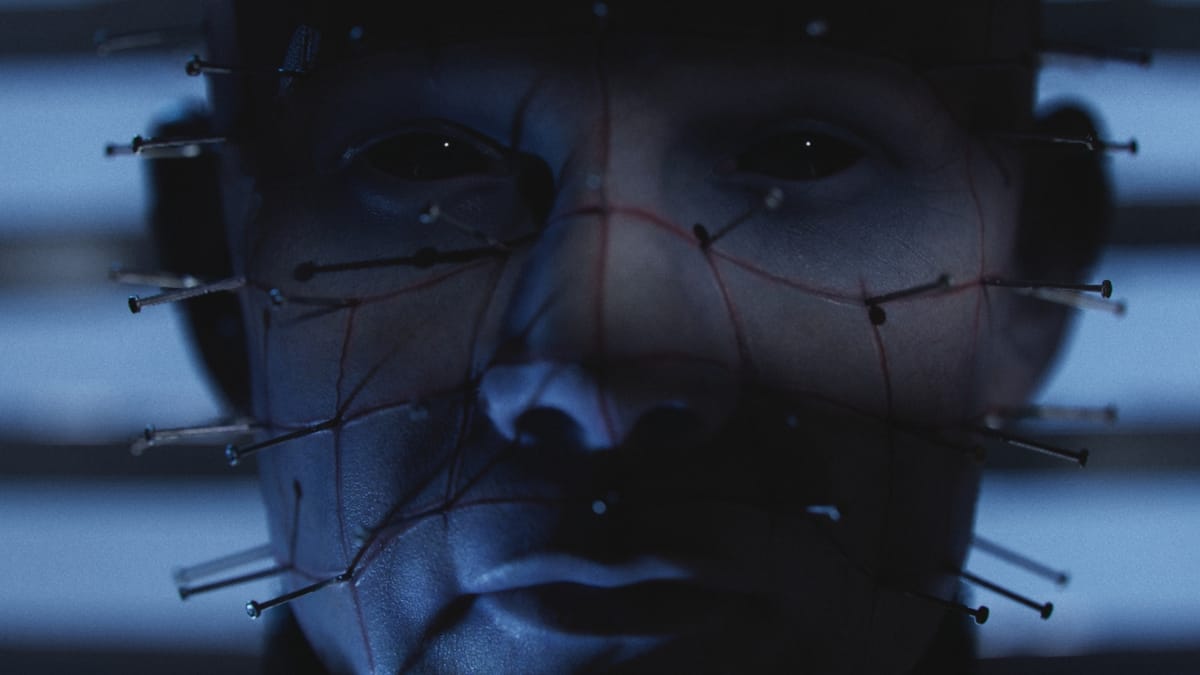 A new hand touches the cube in Clive Barker's Hellraiser: Revival
