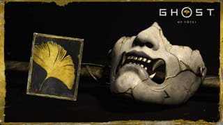 Image of mask and clue card with golden ginkgo leaf celebrating Ghost of Yotei having gone gold
