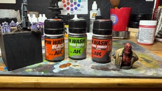 A photo of AK Interactive Pin Washes and 2 models