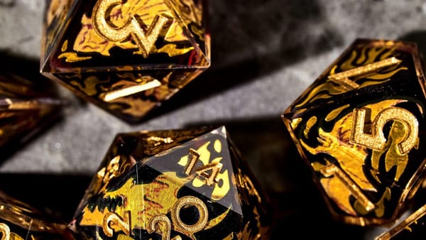 Quest’s End Whiskey teams up with Dispel Dice for their Dragon Bones dice set