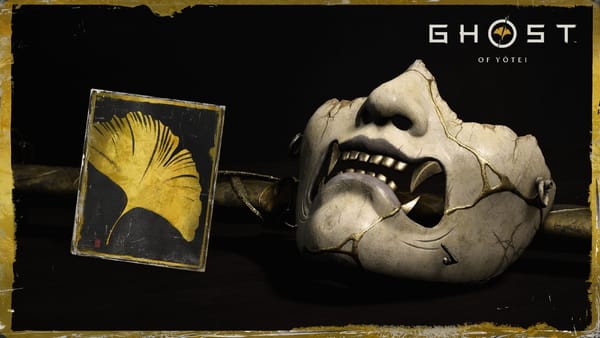 Image of mask and clue card with golden ginkgo leaf celebrating Ghost of Yotei having gone gold