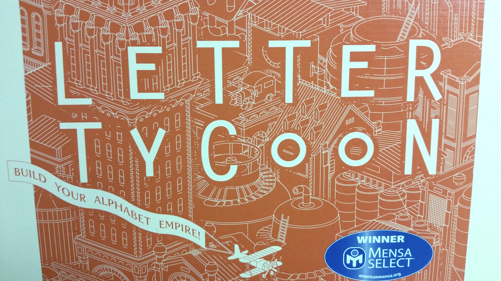 Tycoon Written with Wooden Letters on a Blue Background Stock