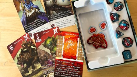 An image showing Dice Conquest cards, dice, and box