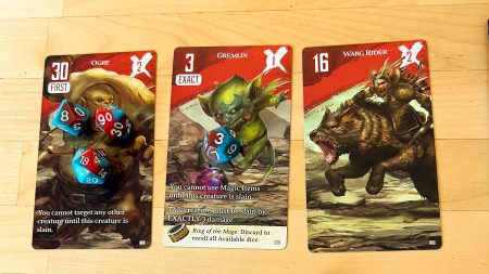 An image featuring three of the dice conquest monsters, along with dice on them