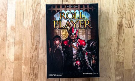 A photo featuring the box art for Roll Player