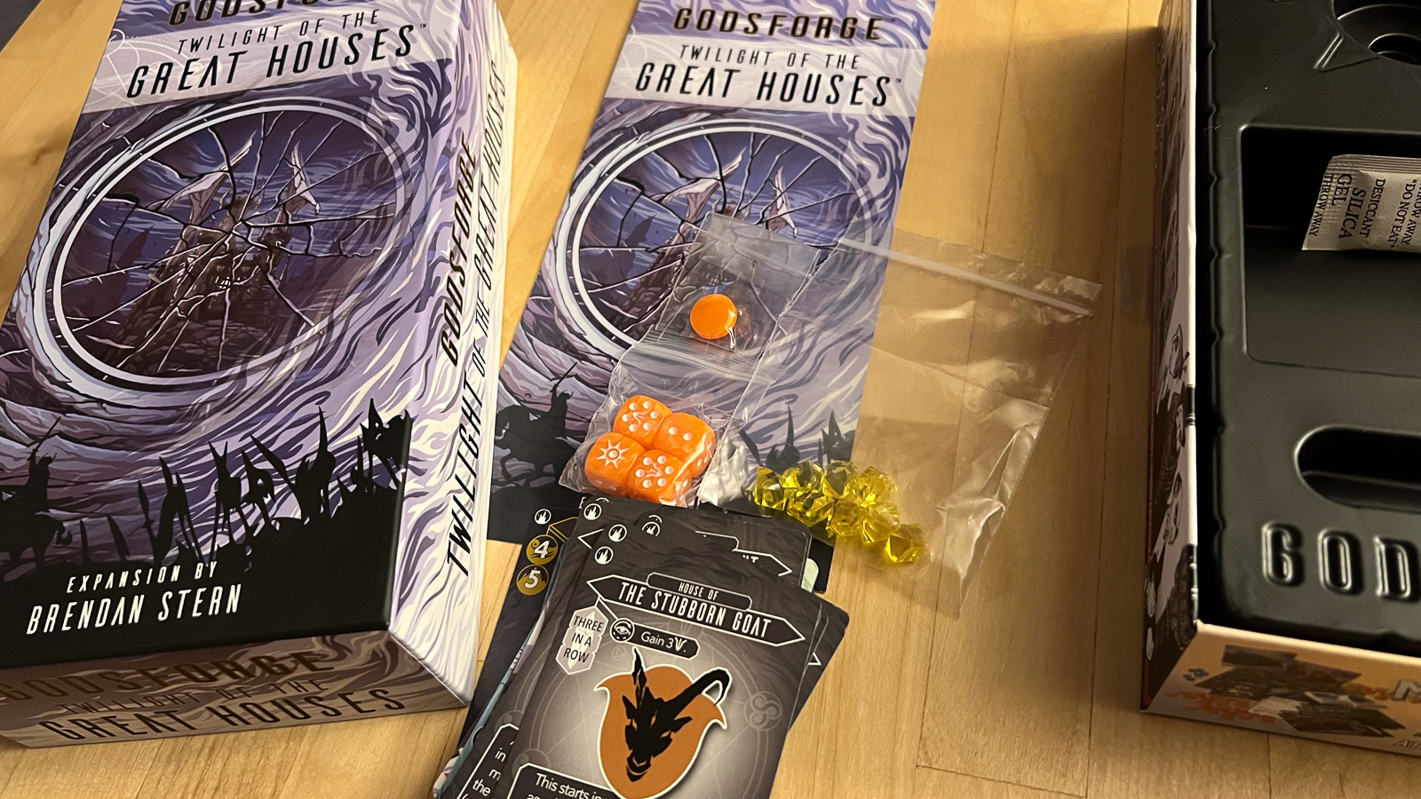 A photo of the cards, gems, and tokens for Godforge: Twilight of the Great Houses